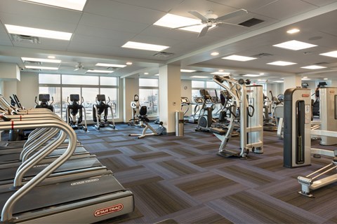 a gym with cardio machines and other exercise equipment