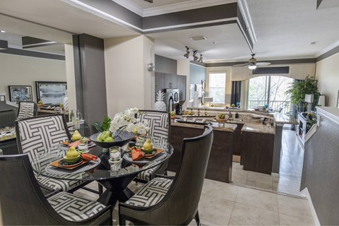 Spacious and well lit kitchen with wood flooring and stainless steel appliances