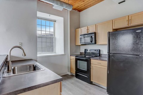 a kitchen with a sink and a refrigerator