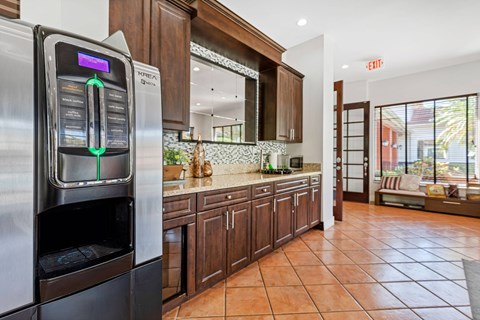a kitchen with a stainless steel refrigerator and a microwave