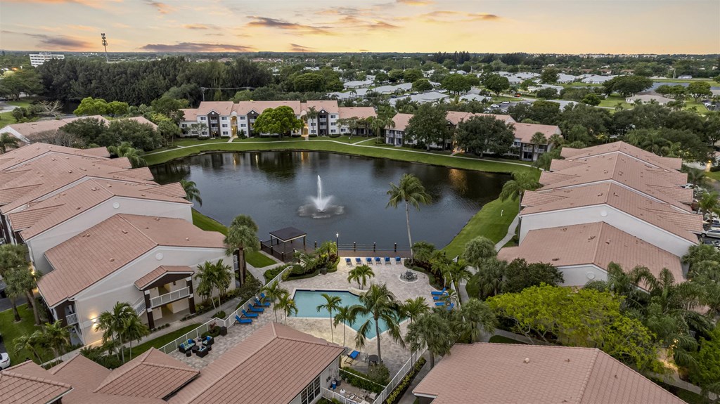 an aerial view of a fountain in the middle of a pond