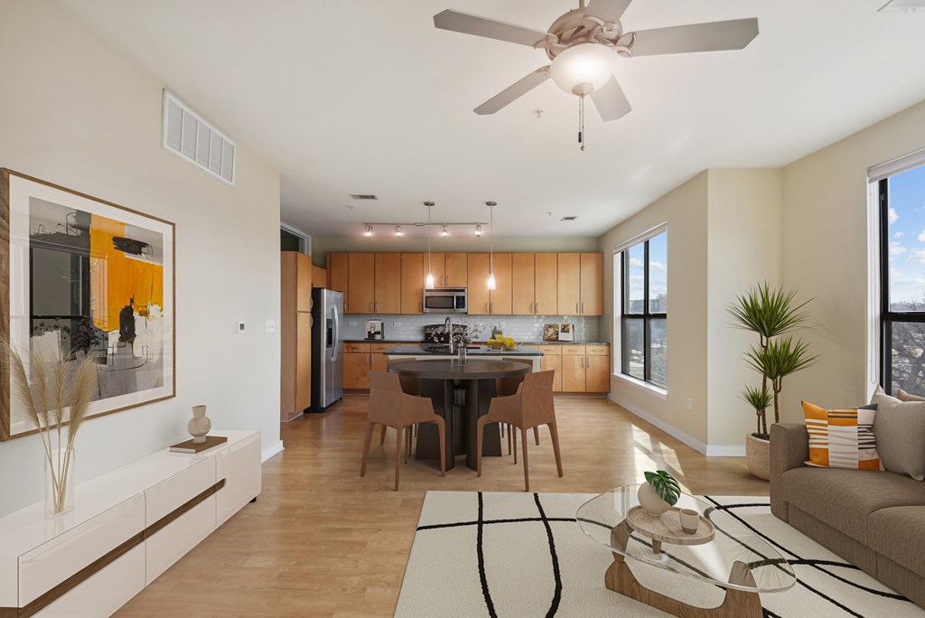 A modern kitchen with a dining table and chairs.