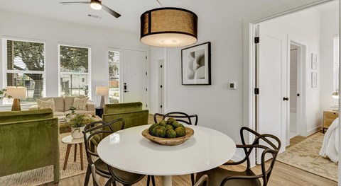 a dining room table with a basket of fruit on it
