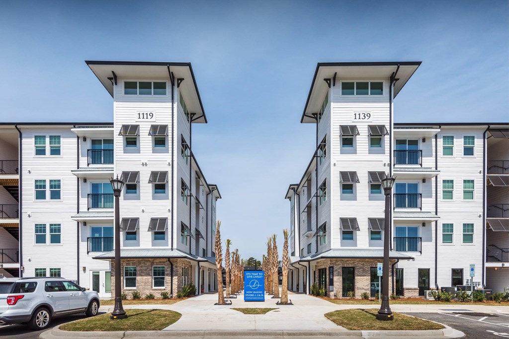 Two identical white buildings with the numbers 1119 and 1139 on them.
