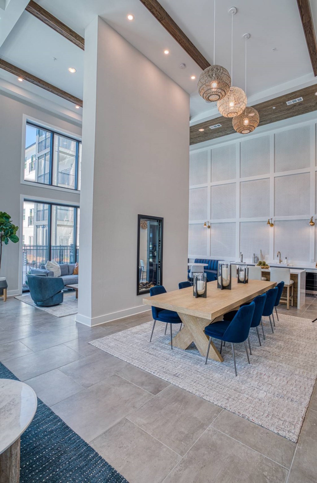 A dining room with a long table and chairs.