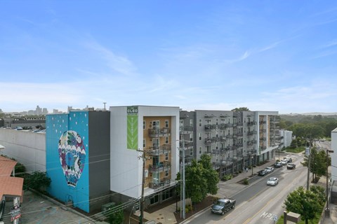 A street view of a city with cars and buildings.