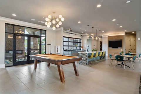 Community Billiards Room with Bar Area, Tables, Seating, and Large