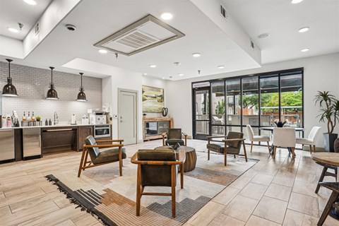 A modern kitchen with a dining table and chairs.