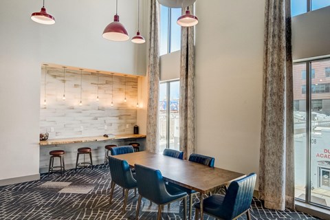 A conference room with a long table and chairs.