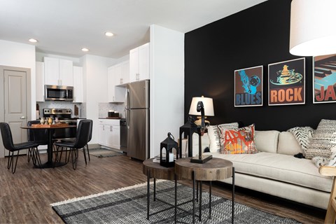 A modern kitchen with a dining table and chairs.