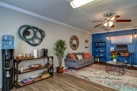Resident Clubroom with couch seating and computer desk