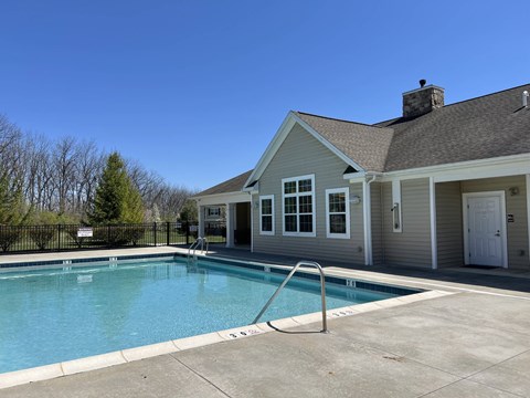 Northampton, PA Garden-Style Apartments with In-Unit Washer and Dryer - Residences at Willow Ridge - A Pool Area with Metal Handrails, and Spacious Concrete Deck.