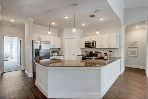 a kitchen with a counter top and a refrigerator
