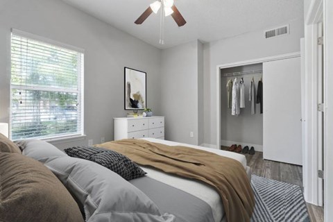 a white bedroom with a bed at Towns at Chapel Hill in Plano Texas