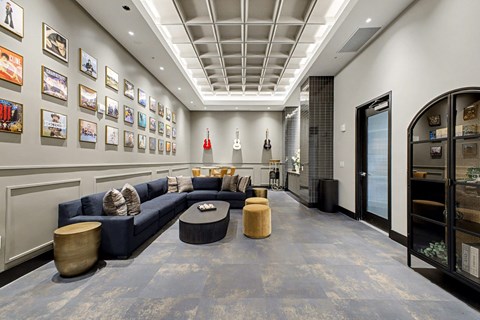 A living room with a blue couch and a coffee table.