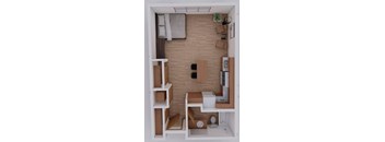 A small room with a brick wall and a white door.