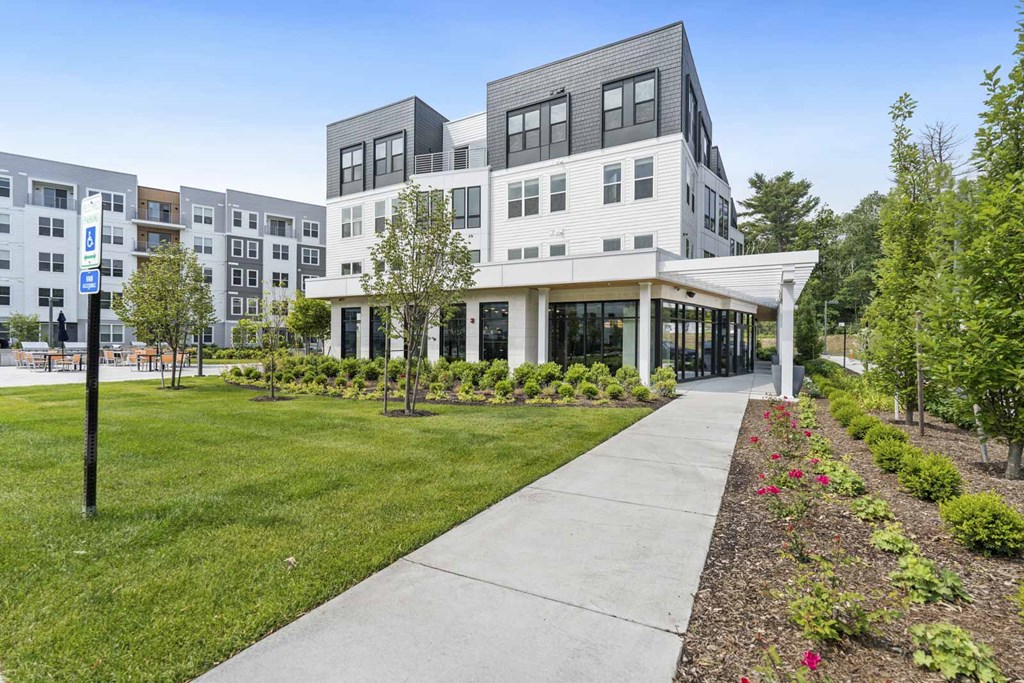 A modern building with a walkway in front of it.