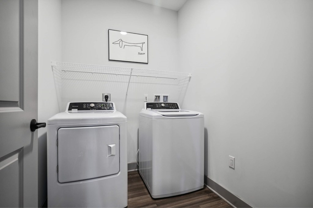 Two washing machines in a laundry room.