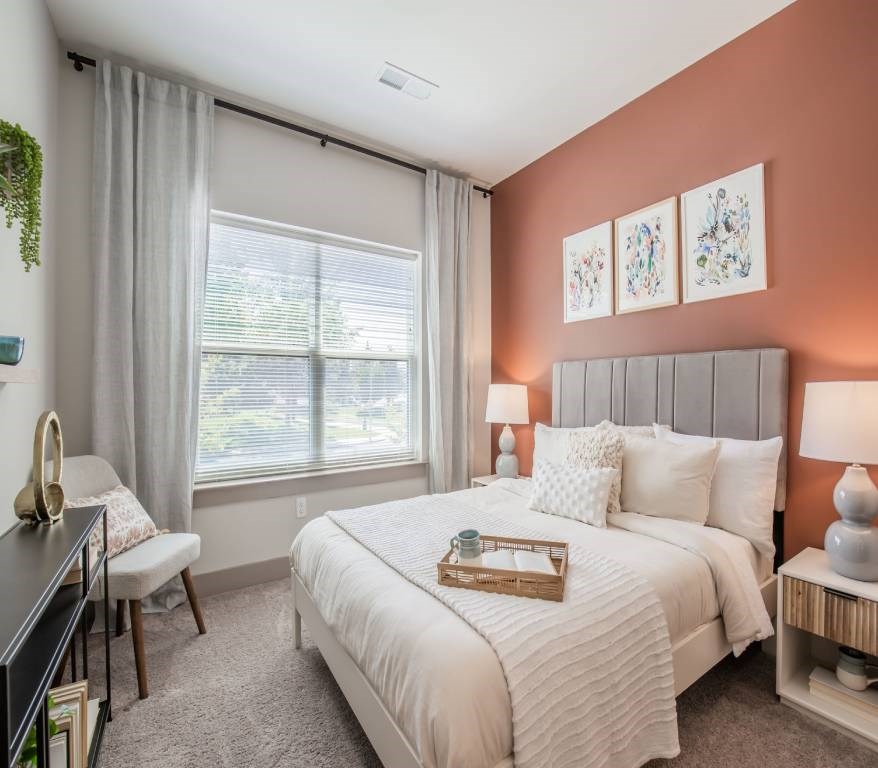 Silver Spring, MD Apartments Near Matthew Henson State Park - Atelier Apartments - Bedroom Featuring Plush Carpeting, Large Windows With Curtains, And High Ceilings