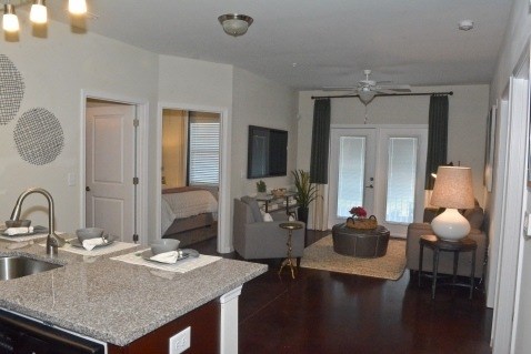 A kitchen with a sink and a counter.