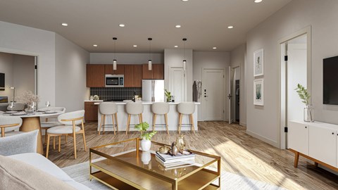 A modern living room with a coffee table in the center.