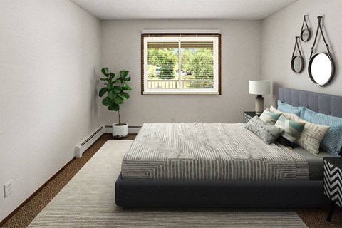 A bedroom with a large bed and a window with a view of trees.