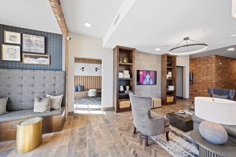 A living room with a grey sofa and a wooden coffee table.