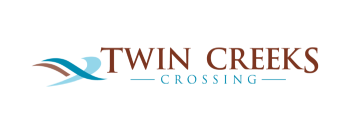 A logo with the words "Twin Creeks Crossing" in stylized font.