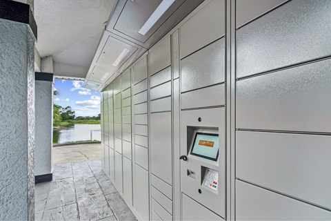 A row of grey lockers with a keypad and card slot.