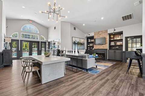 A modern kitchen with a dining table and chairs.