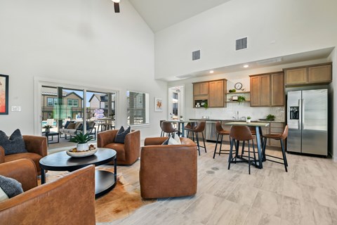 A modern living room with brown leather chairs and a black coffee table.