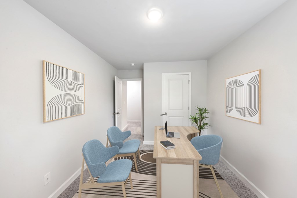 a living room with blue chairs and a table