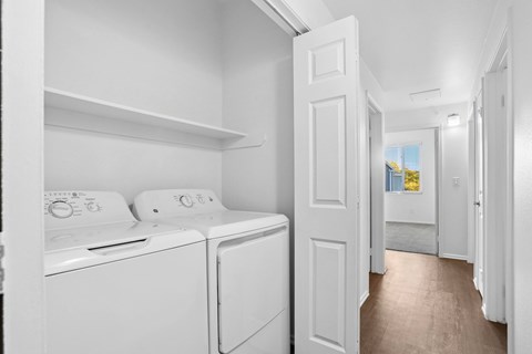 A laundry room with a washer and dryer.