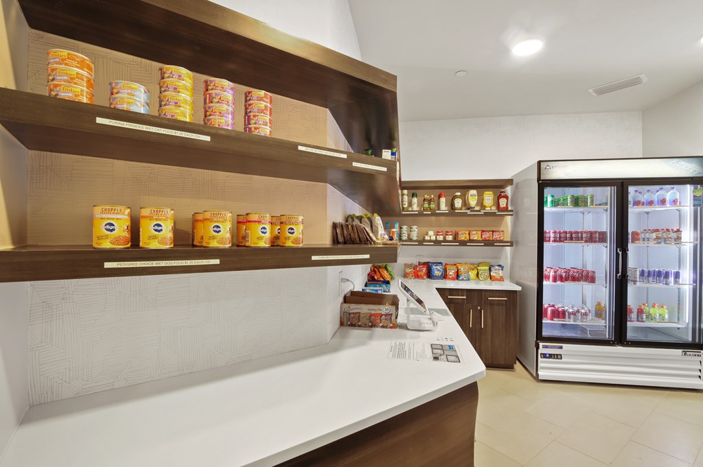 a supermarket with a refrigerator and a counter with canned goods