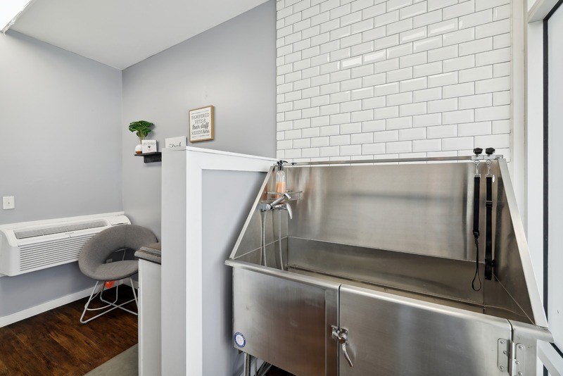 a kitchen with a stainless steel counter top and a sink