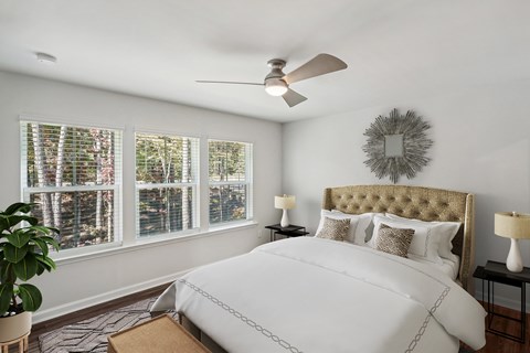Bedroom with white walls and a ceiling fan inside a home at Porchlight Brier Creek