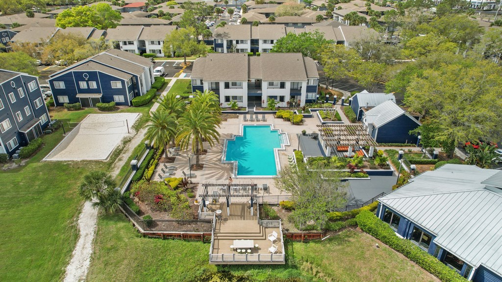 a mansion with a swimming pool in front of a house