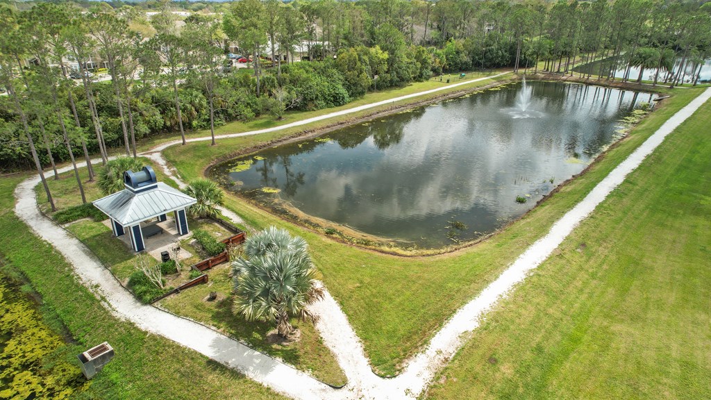 a park with a pond and a gazebo