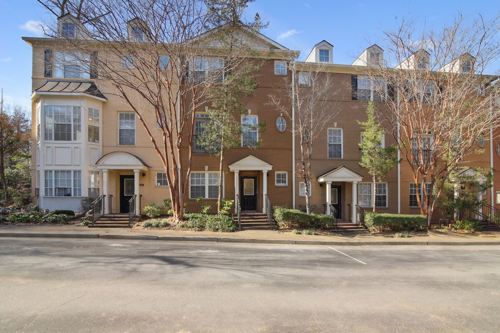 the front of a red brick apartment building
