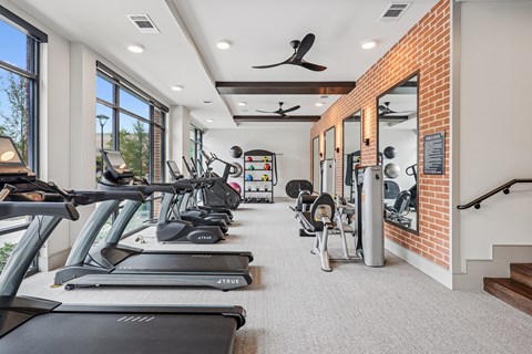 A gym with treadmills and exercise equipment.