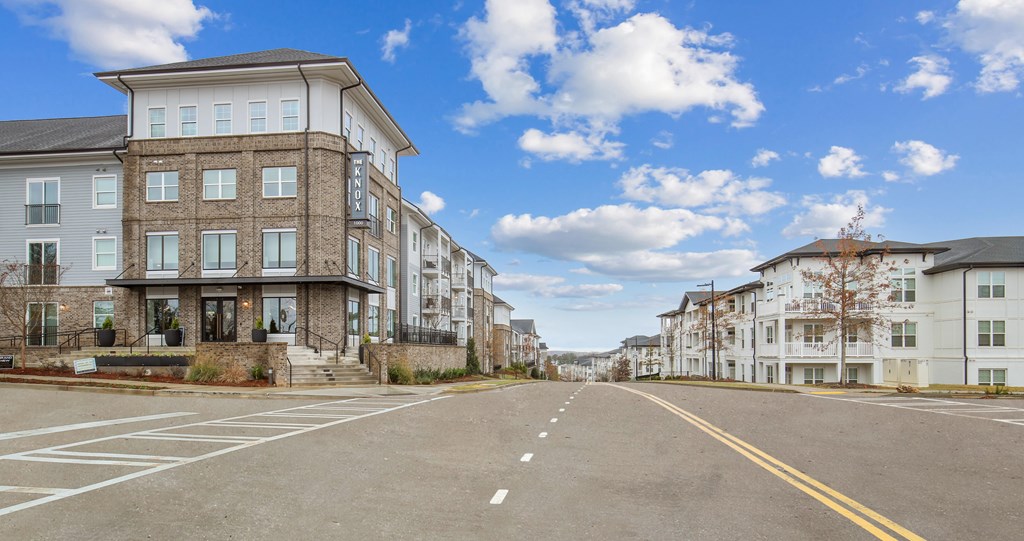 an empty street with houses on the side of it