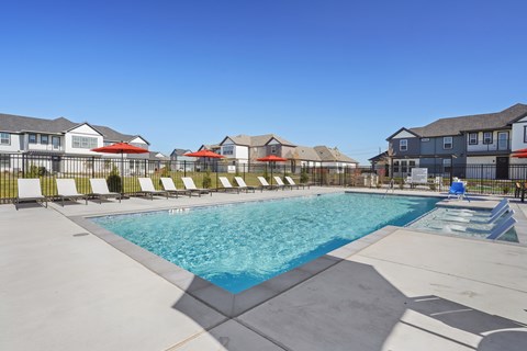 resort style pool in Anna, Texas with tanning deck
