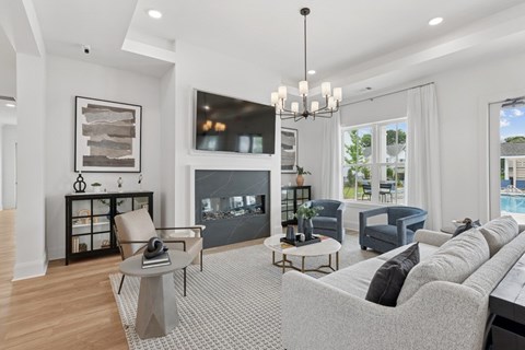A modern living room with a grey sofa and a coffee table.