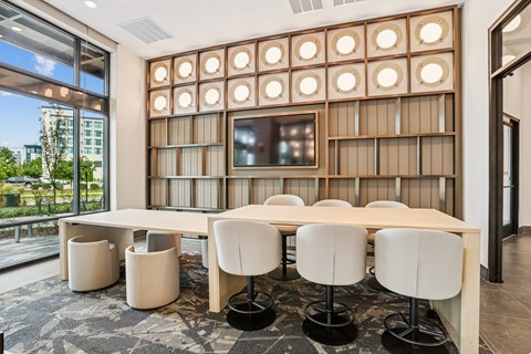 A conference room with a long table and chairs.