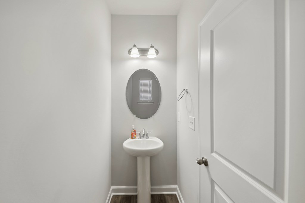a small bathroom with a sink and a mirror