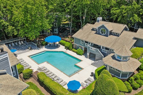 A large house with a pool in the backyard.