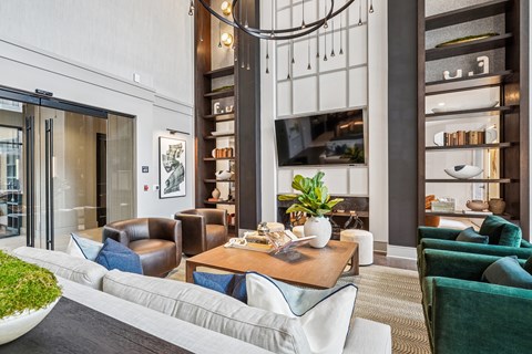 A modern living room with a grey sofa and a coffee table.
