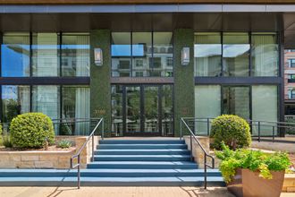 the facade of a building with steps in front of it