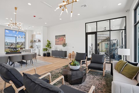 A modern living room with a large grey sofa and a wooden coffee table.