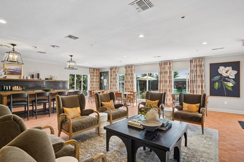 A living room with a table and chairs.